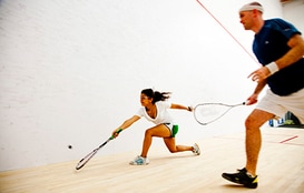 Two squash players on the court at a Junior Squash Program by Squash Revolution in Bethesda MD